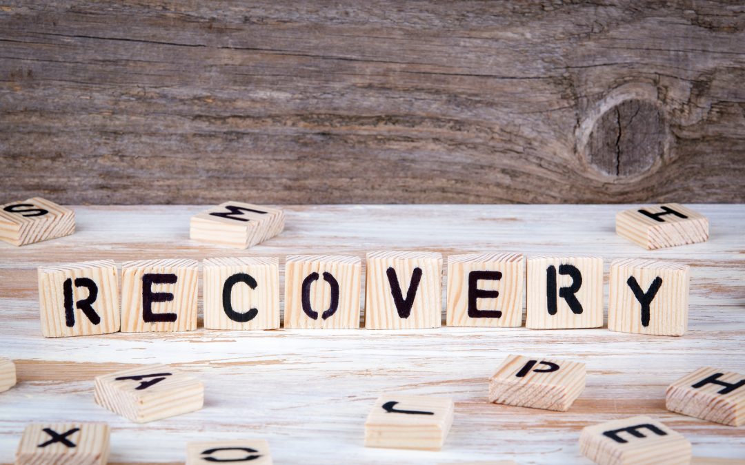 recovery spelled out with wooden letter tiles