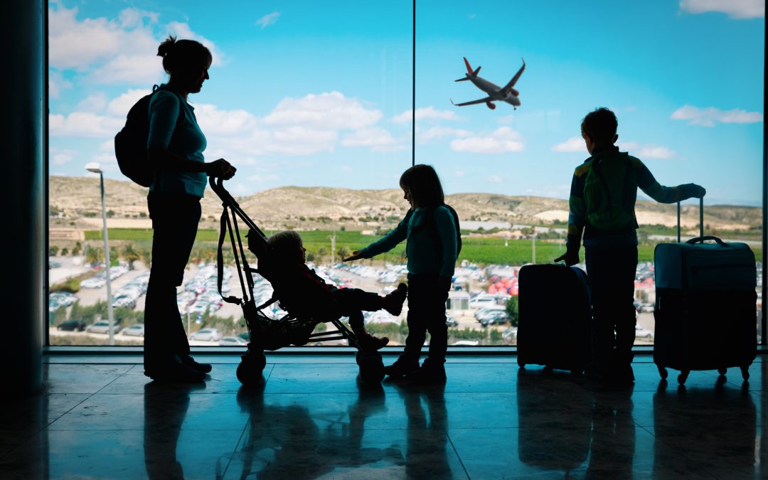 woman traveling with children in airport