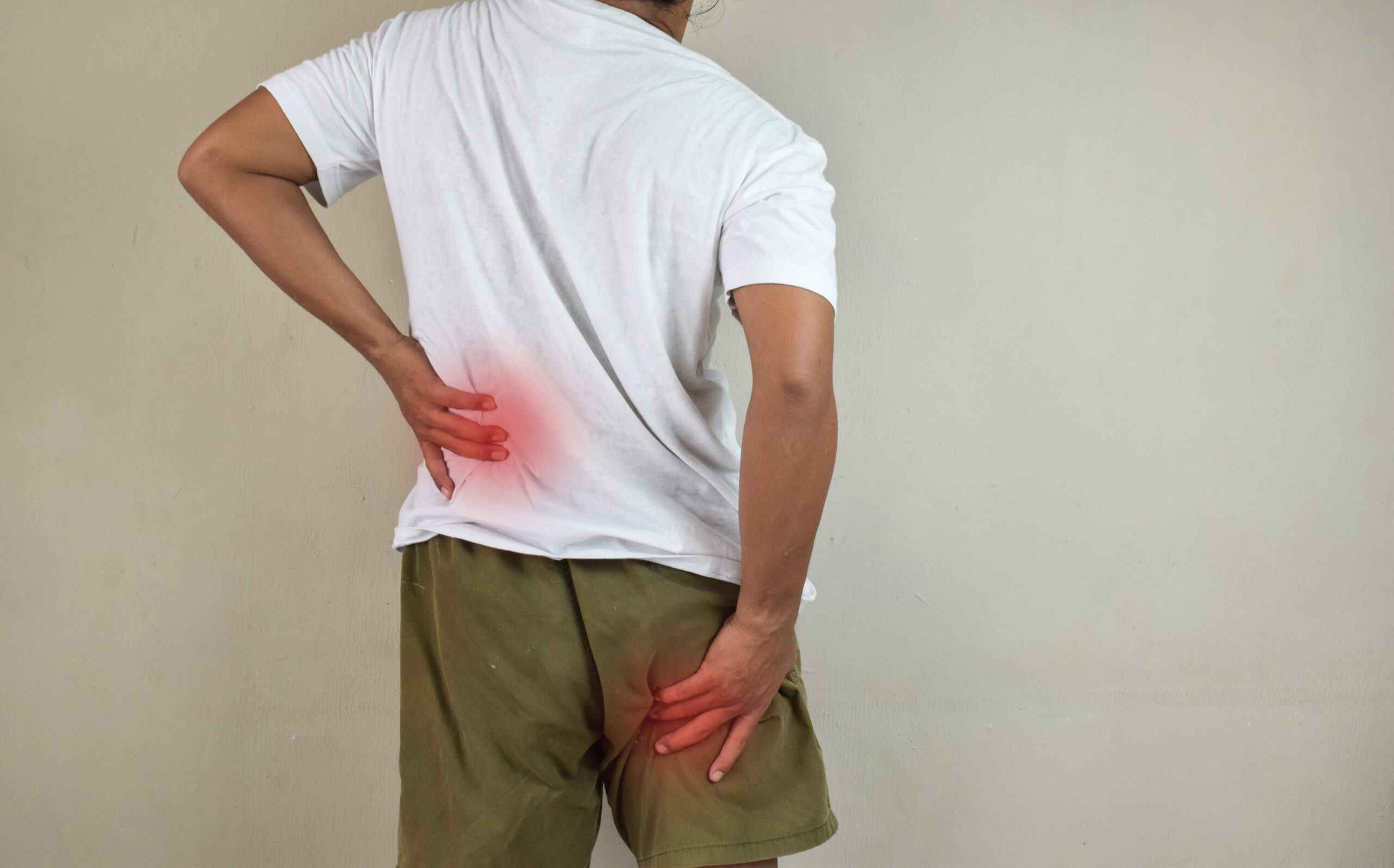 person holding their knee in pain