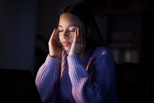 Woman with a headache.